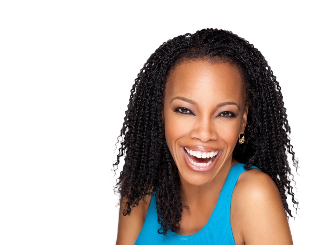 April Yvette Thompson laughing, in a bright blue top